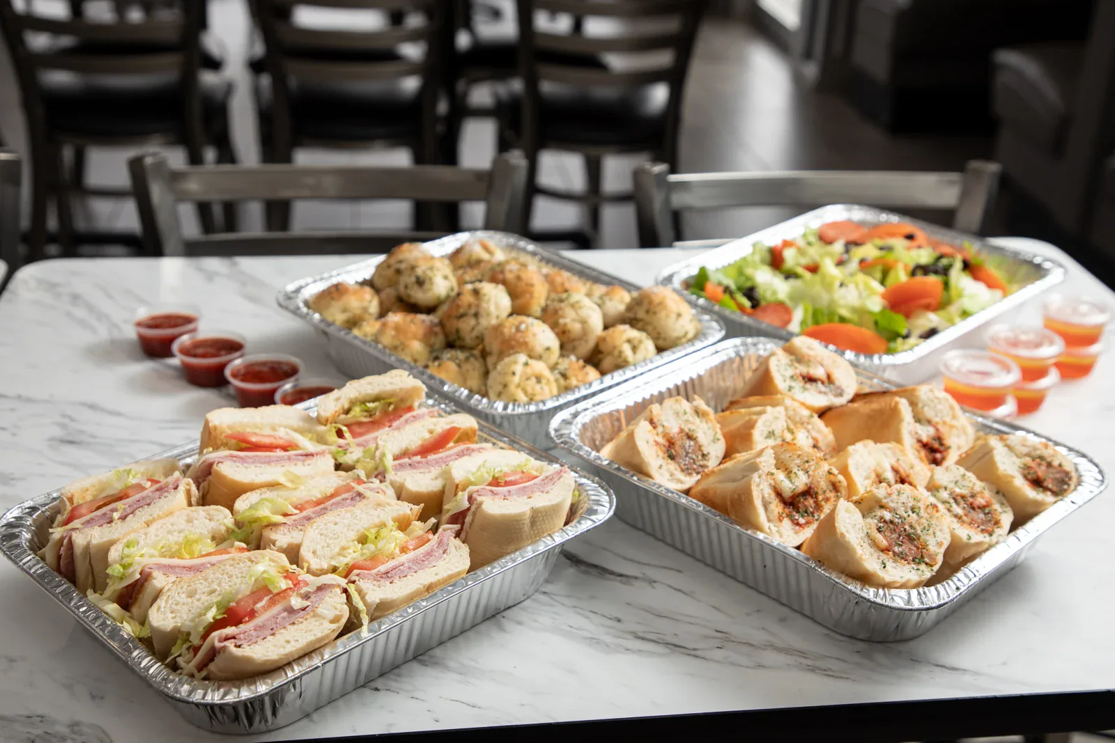 Brooklyn Pizzeria sandwich, garlic knot and salad trays for sharing