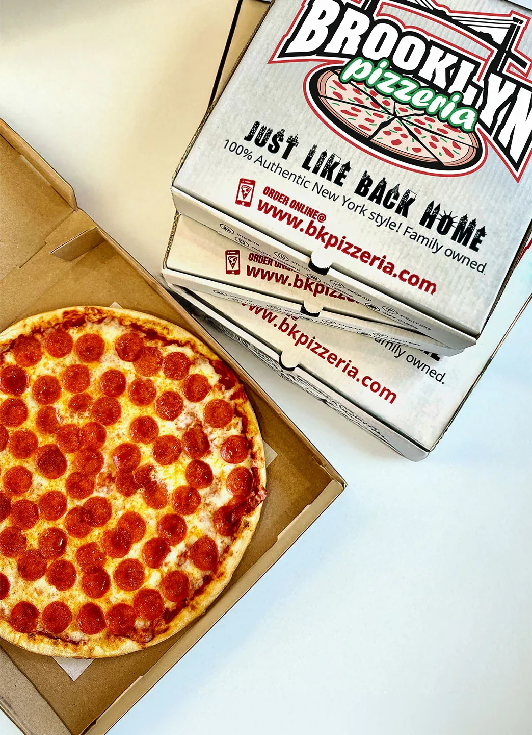 A Brooklyn Pizzeria pizza with its branded box